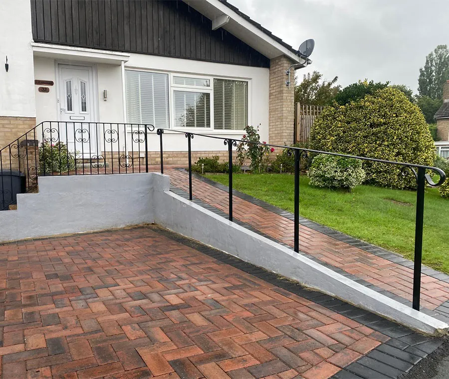 Outdoor handrail fitted along a garden path and ramp The Handrail People
